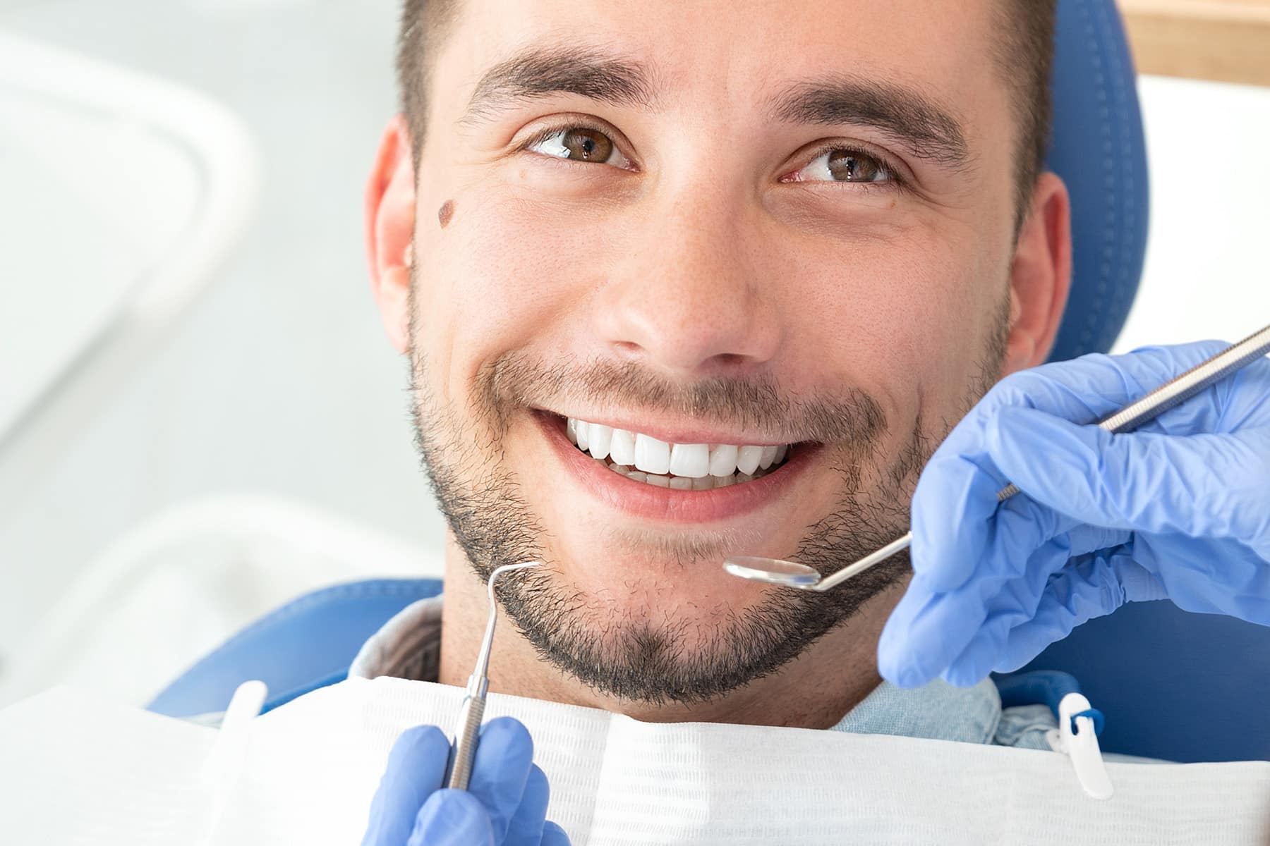 Man getting a restorative dental procedure in Thornton, CO