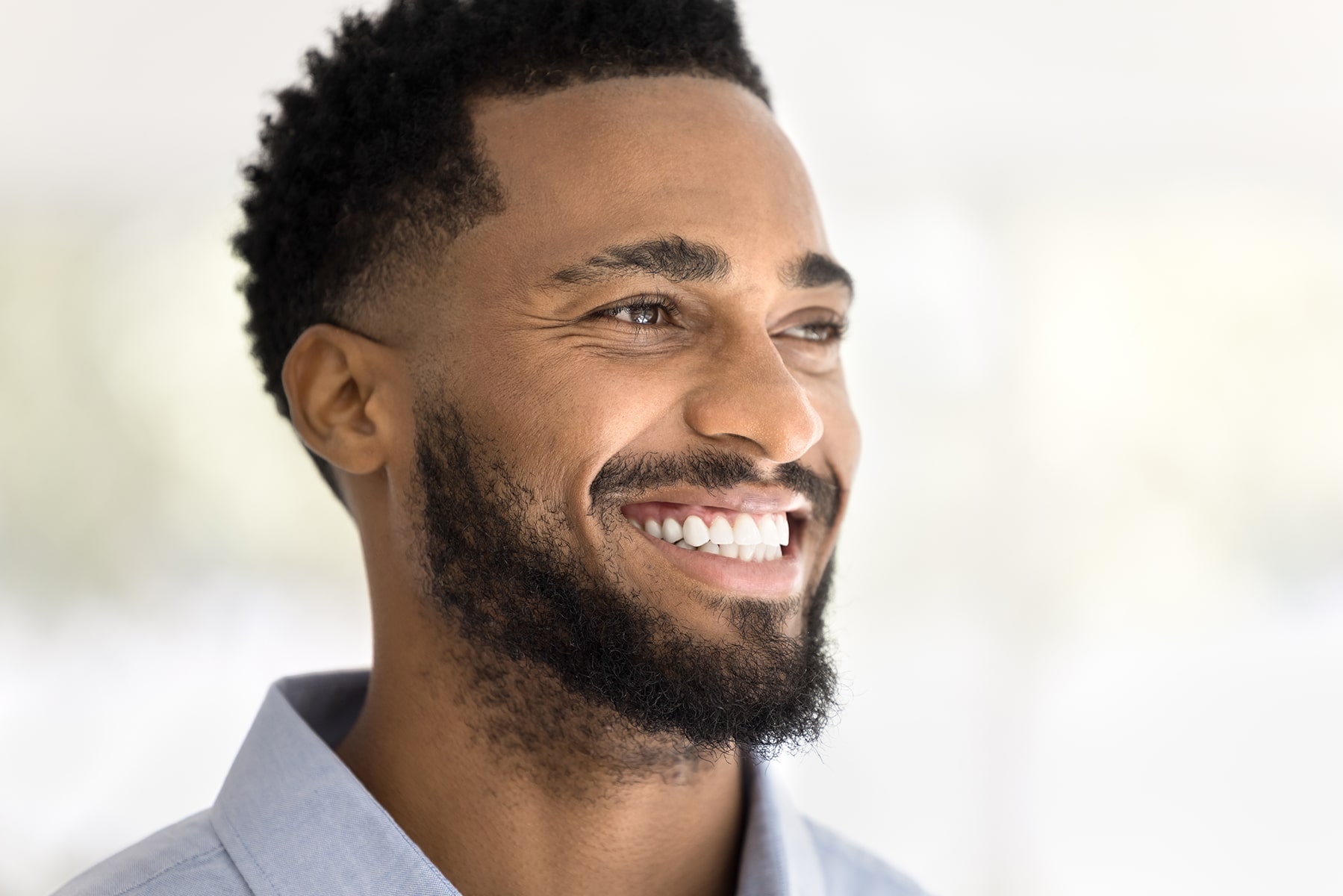 Man smiling after cosmetic dental treatment in Thornton, CO