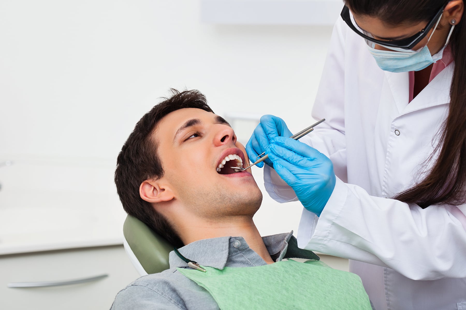 Man at dentist exam appointment in Thornton, CO